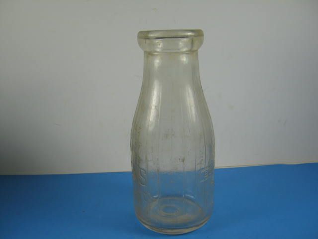 Glass milk bottle marked Bordens Farm Products Co. IL  